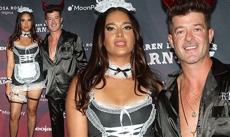 Robin Thicke Wears Satin Pajamas And Devil Horns While April Love Geary Sports French Maid Costume