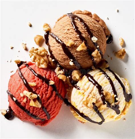 Three Scoops Of Ice Cream Drizzled With Chocolate