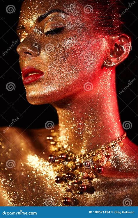 Portrait Of Beautiful Woman With Sparkles On Her Face Stock Photo