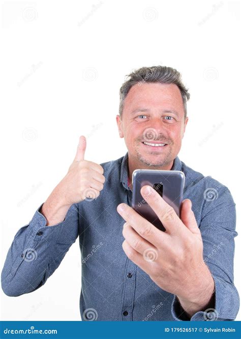 Portrait Of Cheerful Bearded Man Taking Selfie Showing Thumbs Up Gesture Over White Background