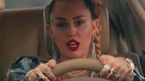 Miley Cyrus Releases New Music Video For Mark Ronson Song Nothing Breaks Like A Heart Teen Vogue