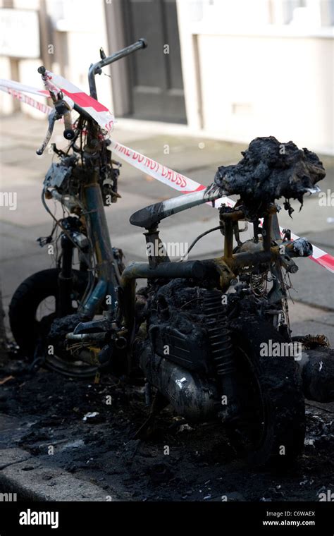 Burnt Motorbike On Pavement During London Riots Stock Photo Alamy