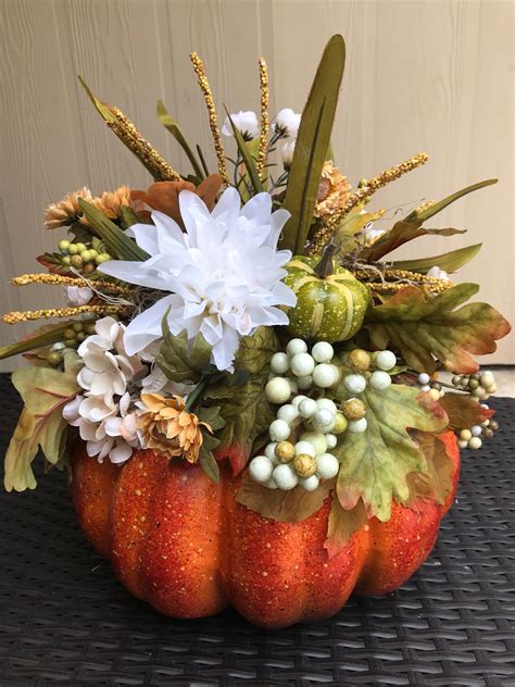 centerpiece for dining table with pumpkin decorations for fall decor or thanksgiving centerpiece