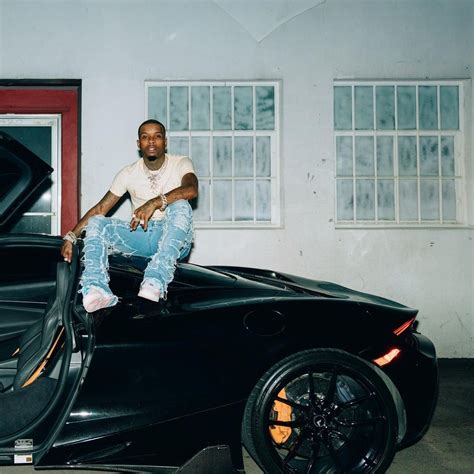 Tory Lanez Continues To Pose Sitting On His Cars This Time On His
