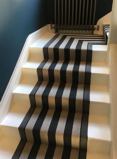 Our bold single repeat design is recoloured in an elegant midnight blue. Roger Oates Fitzroy Black stair runner carpet to ...