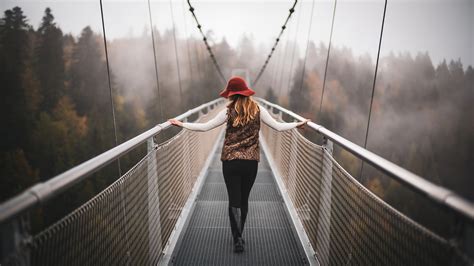 Girl Walking On Switzerland Mountains Bridges 4k Wallpaperhd Girls