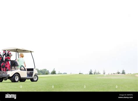 Man And Woman Sitting In Golf Cart Hi Res Stock Photography And Images