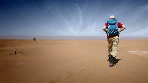 Man Walking On Desert Stock Footage Video 6374441 Shutterstock