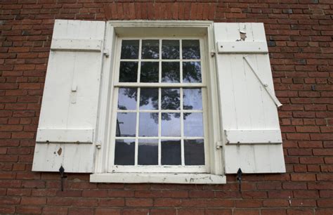 An Eight Over Twelve Sash Window With Shutters Clippix Etc