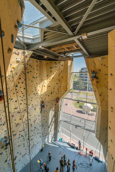 Cave Like Apertures Frame Climbing Walls At Nl Architects Sports Hall