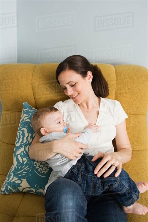 A Mother Holding Her Baby Stock Photo Dissolve