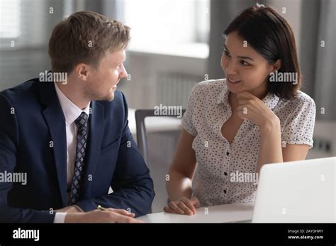 Diverse Office Coworkers Talk Chatting At Workplace Stock Photo Alamy