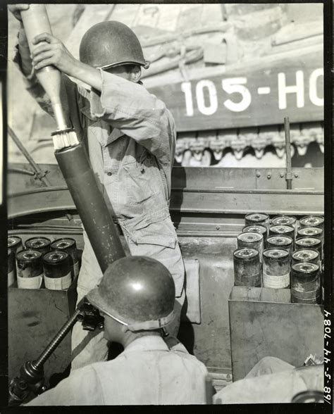 A Gunner Of 81mm Mortar Prepares To Drop A Mortar Shell Into Tube