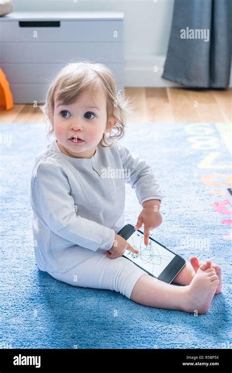 16 Month Old Baby Girl With Cell Phone Stock Photo Alamy