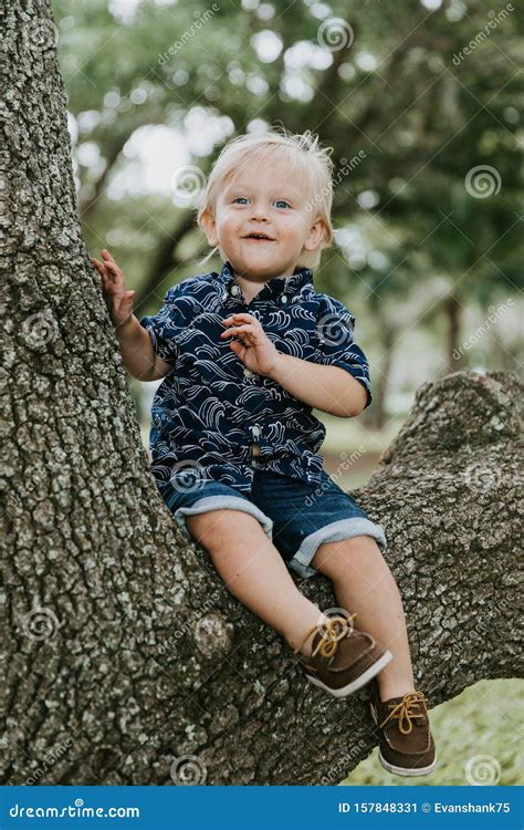 Adorably Happy And Cute Little Caucasian Toddler Baby Boy With Long