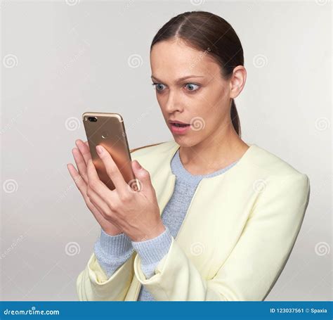 Puzzled Woman Looking On Her Smartphone Stock Image Image Of Female
