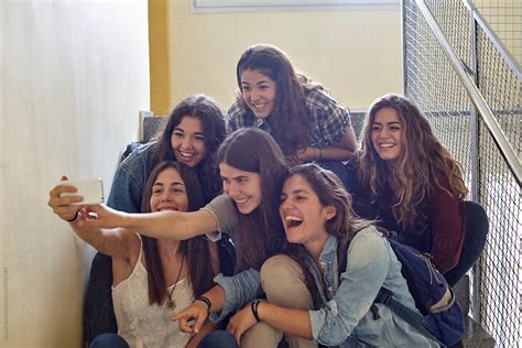 Hilarious Moment Of A Group Of Girl Friends Taking A Selfie By Stocksy Contributor Miquel