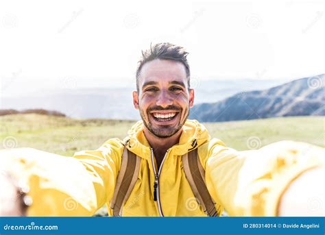 Happy Hiker Taking A Selfie On The Top Of A Mountain Smiling Man