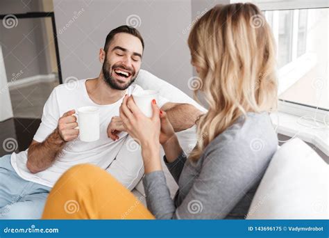 Young Cute Loving Couple Indoors At Home Talking With Each Other Stock