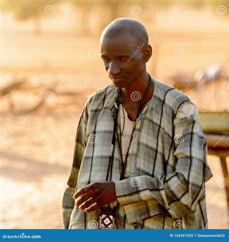 Unidentified Fulani Man In Plaid Shirt Looks Down Fulanis Peu