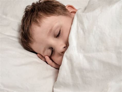 Sleeping Young Boy In White Bed Stock Photo Image Of Head Bedtime