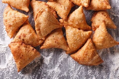 Pile Of Baking Samosas On A Floured Table Horizontal Top View — Stock