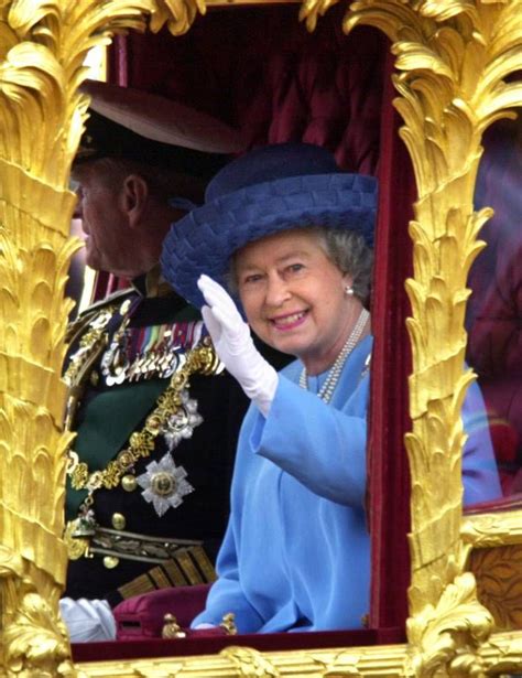 June Queen Elizabeth II Waving To The Crowd As She Rides In The Gold State Coach From