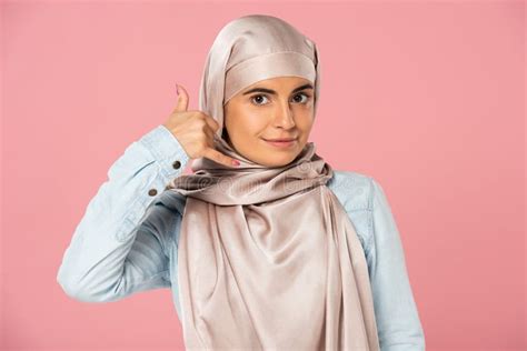 Frightened Muslim Girl In Hijab Closing Face Isolated On Pink Stock