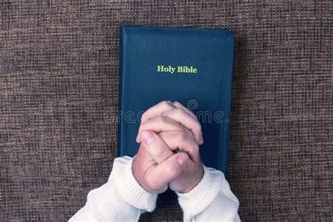 Folded Hands Of The Man In The Holy Bible Stock Photo Image Of Faith