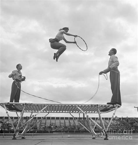 Girl Bouncing Off Trampoline By Bettmann