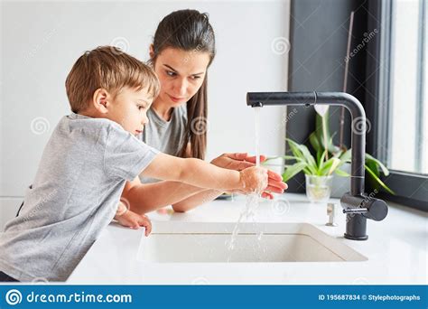 Child Learns Hand Washing With Soap From Mother Stock Photo - Image of care, mother: 195687834