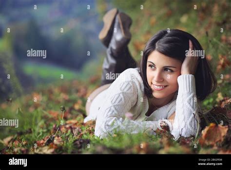 Beautiful Young Woman Relaxing In Autumn Countryside Seasonal And