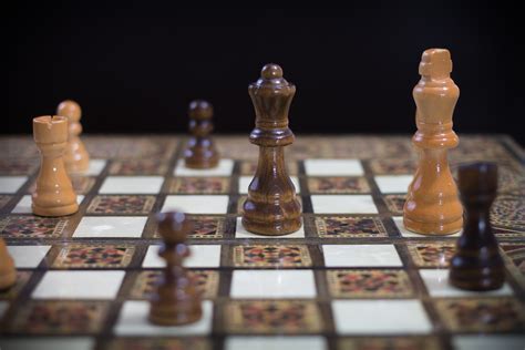 White Chess Piece On Top Of Chess Board · Free Stock Photo