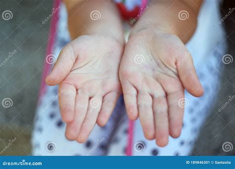 Childand X27s Hands Holding Offering Giving Something Or Asking Begging