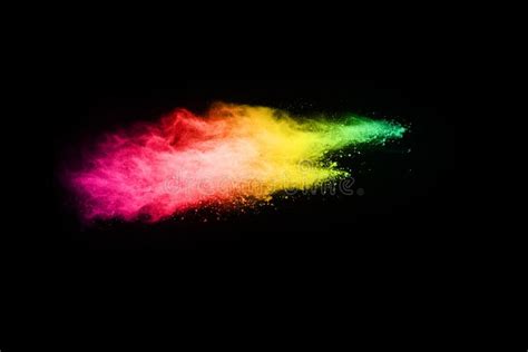 Abstract Colored Dust Explosion On Black Background Stock Photo