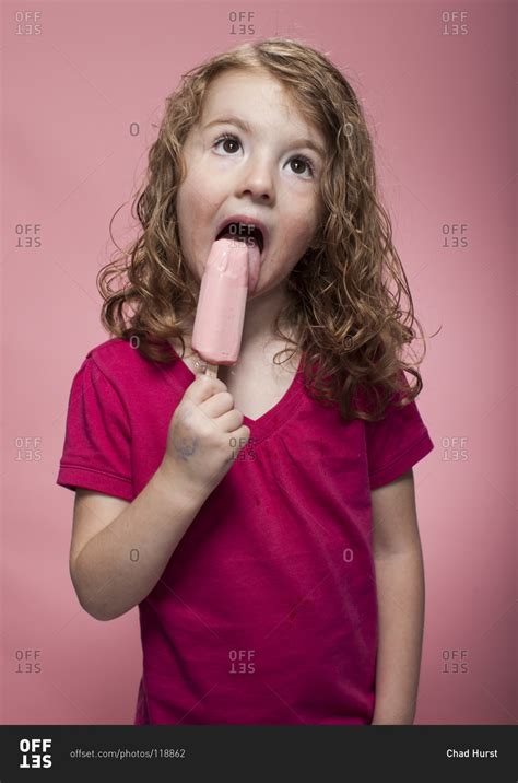 Redhead Girl Eating Fruity Ice Cream Bar Stock Photo Offset
