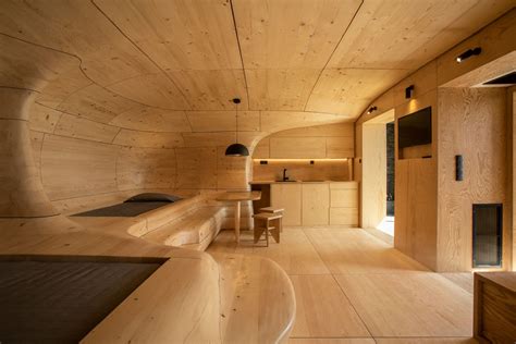 Two Greek Architects Design Sculptural Wooden Resort Interior They