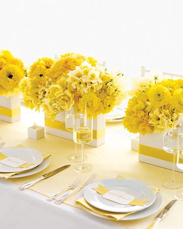 Spring inspired tall glass centerpiece, made up of yellow sunflowers, white spider chrysanthemums, blue hydrangeas, and yellow dendrobium orchids ellow dendrobium orchids | shot with charm photography. Felder & Co., llc: Spring Time Wedding Ideas -Centerpieces