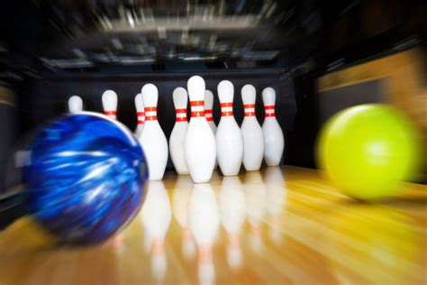 Two Bowling Balls Approaching Pins With Motion Blur Effect Stock Photo
