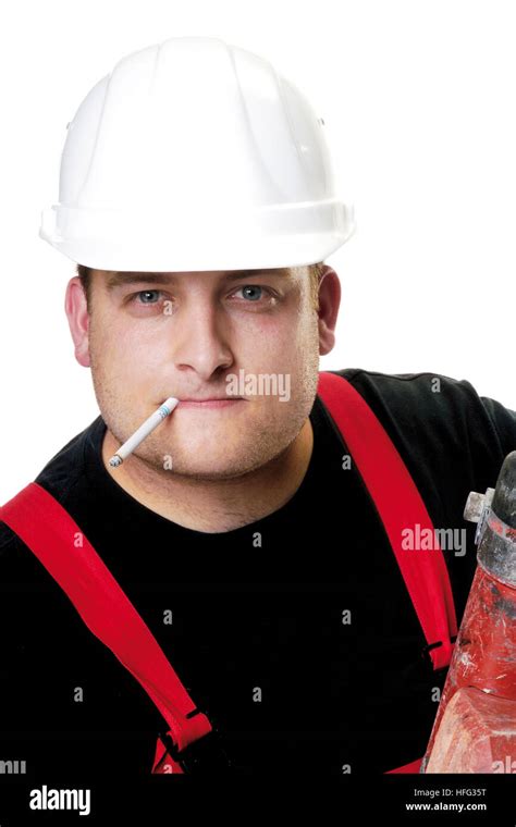 Construction Worker Wearing A White Hardhat Smoking A Cigarette Stock