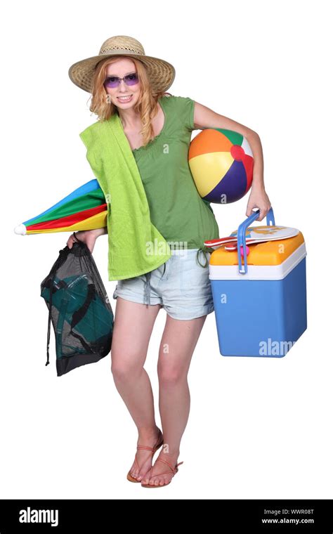 Girl Carrying Things To The Beach Stock Photo Alamy