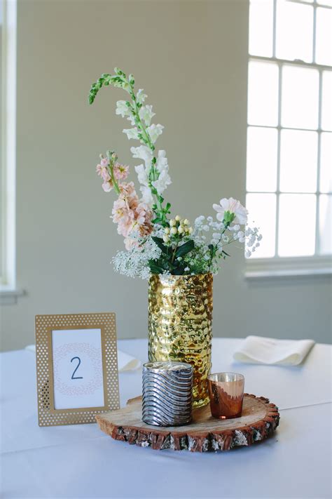 Neutral Colored Flower Centerpiece In Gold Vase