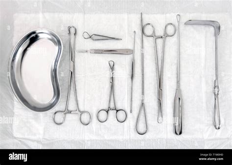 Gynecological Sterile Tools A Lot Of Instruments Of Gynecologist On White Background Top View