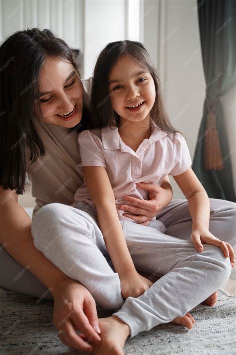 Premium Photo | Mother tickling girl full shot