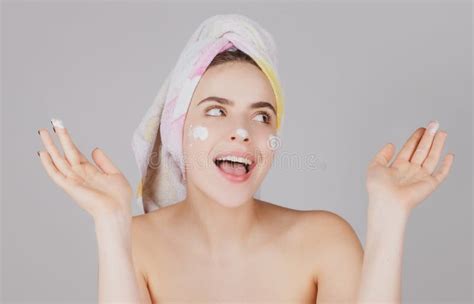 excited woman facial mask face clay beautiful amazed woman with cosmetic facial procedure spa