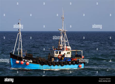 Fishing Boat At Sea Stock Photo Alamy