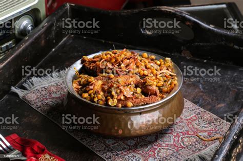Majboos Chicken With Dal Dhal And Lentil Served In Dish Isolated On Red