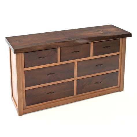 It's made from solid wood and features tapered block feet with turned details and crown molding for a traditional silhouette. Solid Wood Dresser with Live Edge Top