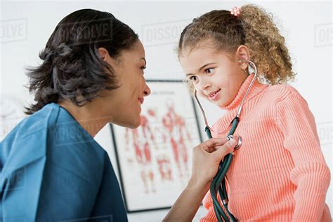 Doctor Examining Girl 10 11 Stock Photo Dissolve