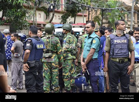 Bangladeshi Police And Military Gather In An Intersection Near An